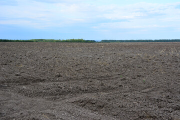 the soil is plowed and ready for planting horizon line 