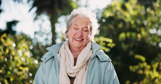 Portrait, laugh and senior woman in nature with wind in hair for fresh air, health and wellness in winter. Face, funny or happy elderly person in garden to relax at retirement park outdoor in Florida