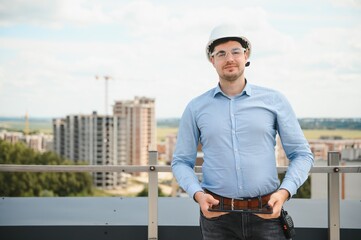 Businessman standing in building in construction process