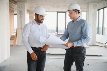 Indian and European construction workers together at a construction site