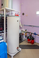 Boiler in basement. Hot water tank. Boiler equipment with pumping station. Gas heating station in...