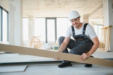 portrait of handsome construction worker on building industry construction site