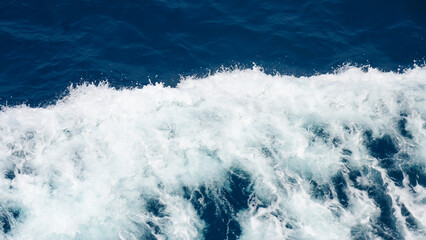 Fototapeta premium Aerial view to ocean waves. Blue water background