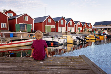 Family, visiting small village Lorudden in Sweden, summertime. Scandinavian coast