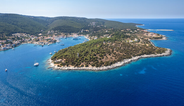 Drone aerial view Greek harbour village of Fiskardo on the Northern tip of Kefalonia Greek island , ionian sea.