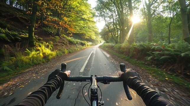 POV shot of blurry motion image of a person riding a bicycle in the autumn forest