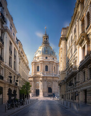 Fototapeta premium Sunrise over a historic European city street with classical architecture