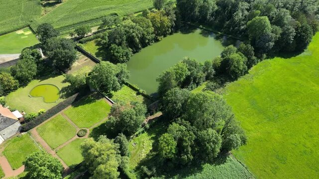 castle garden park private estate slow forward aerial drone shot green lake water fun pleasure