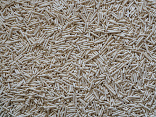 Background of the fine particles of tofu cat litter. Cat litter that absorbent and neutralizes odour quickly. Litter composition that is friendly to the environment and pets