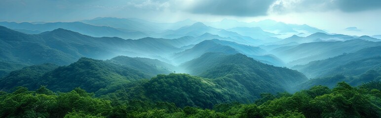 Obraz premium Banner of mountain range with a blue sky and a few clouds