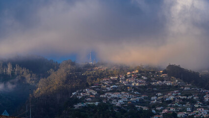 Sunset over houses on hill in Funchal, Madeira, Portugal timelapse