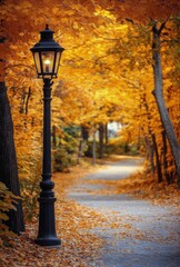 Autumn pathway lined with golden leaves and a vintage lamp in a serene park setting