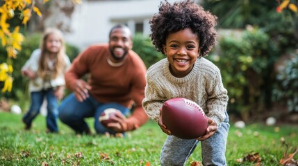 African American family in the backyard playing a friendly game of touch football on Thanksgiving Day
