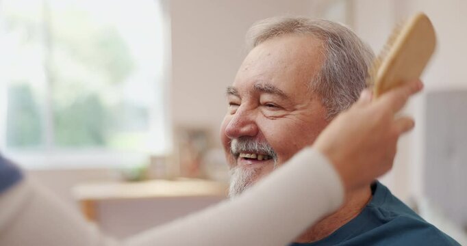 Nurse, brush and elderly man with smile for hair care, assistance and helping hand at home. Professional caregiver, happy and senior person with pride for kindness, healthcare and medical service