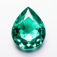 A round emerald organza stone in the shape of a teardrop is set on a smooth white surface.