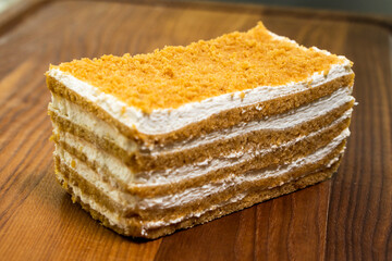 Honey cake Medovik, layer cake on wooden background. Closeup view. dessert