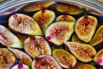 Half cut figs in a pan, ready to  be cooked