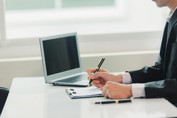 Fototapeta premium Businessman, house and condo sales agent, handing over keys to clients and signing sales or rental agreements at the office. Real estate business concept.