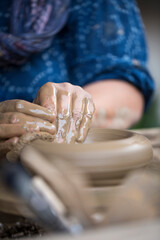 Pottery art in process on a potters wheel