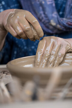 Pottery art in process on a potters wheel