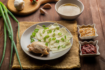Dagestan khinkal homemade dough, meat, thick broth, garlic and greens
