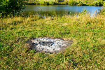 A bonfire on the riverbank.