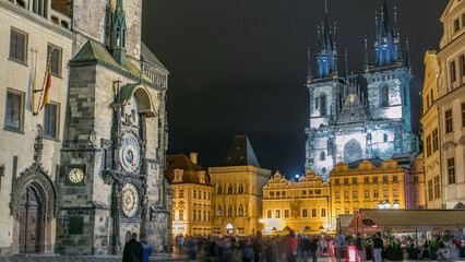 Obraz premium Night time illuminations of the the Old Town Hall timelapse, Town Square and fairy tale Church of our Lady Tyn
