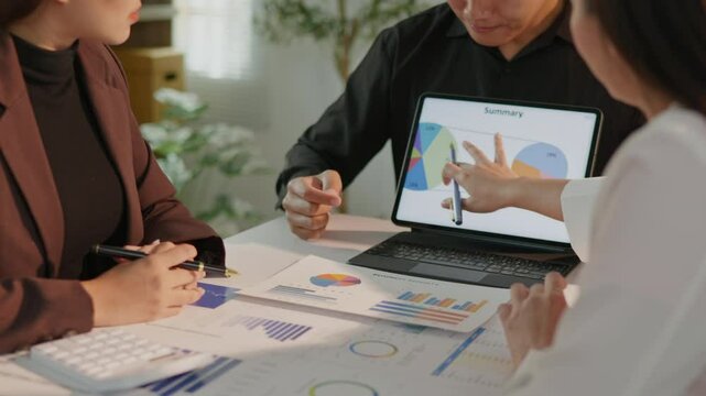 Close up of hands teamwork business group are meeting working calculate and brainstorming about business financial and marketing on paperwork and presentation.