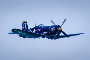 Striking photo of a vintage warplane in flight, capturing the historical significance and classic...