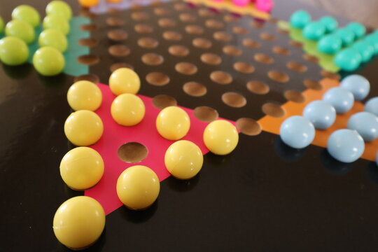 Classic Chinese Checkers Board Game on a Rustic Wooden Table
