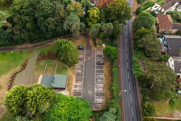 Aerial drone shot over cars driving on the road in Bishops Stortford in England