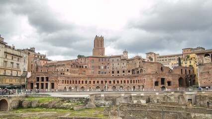 Obraz premium A panoramic view on Trajan's Market timelapse hyperlapse on the Via dei Fori Imperiali, in Rome, Italy