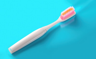 A modern white toothbrush with pink and orange bristles on an bright blue background. Concept of dental hygiene and oral care