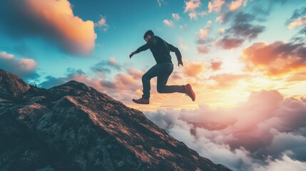 Person leaps from rocky cliff edge during sunset above clouds
