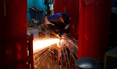 Welder is cutting metal. Metal welding process