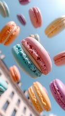 Colorful Macarons Falling Against Blue Sky and Building