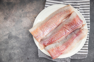fillet raw white fish cod or halibut fresh meal food snack on the table copy space food background...