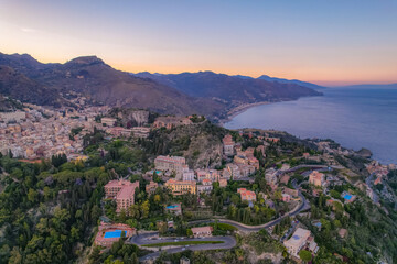 Aerial view of the Ancient theater of Taormina with Mount Etna in the background, Sicily, Italy
