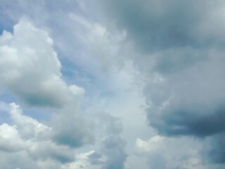 A clear blue sky with a few clouds. The sky is so clear that it almost looks like a painting