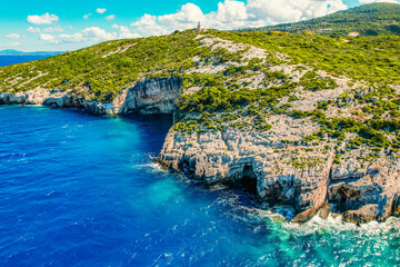 Naklejka premium Blue caves on Zakynthos island or Zante Island, Greece. Beautiful views of azure sea water and nature with cliffs cave