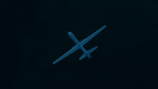 Military Predator Drone Flying At Night Over Water Intelligent Unmanned Vehicle Armed With Missiles Used To Attack Remote Targets