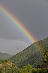 Rainbow among mountains and hills