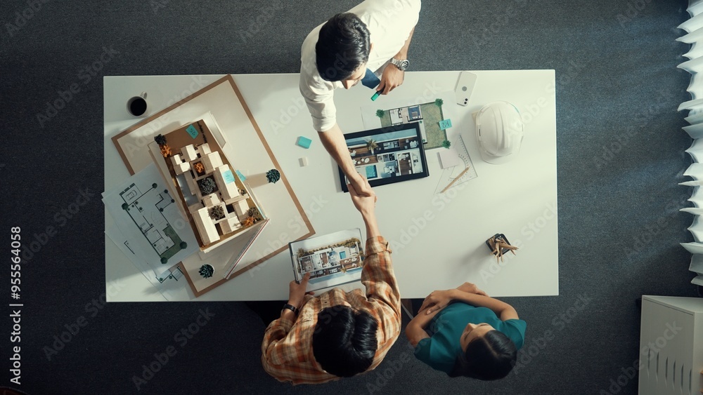 Poster top view of skilled architect engineer working together and shaking hand cooperative team while maki
