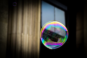 Iridescent soap bubble floating in the sky	