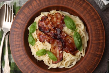 Delicious pasta Carbonara served on table, flat lay
