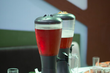 Beer in glass barrels on the table in the Beer Bar.