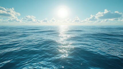 Fototapeta premium A wide-angle view of a sunlit ocean with the sun reflecting off the water, creating a bright and inviting background with space for messaging.