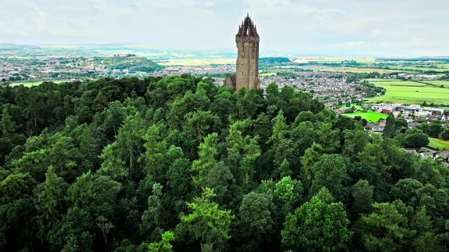 Aerial view of Elaborate Victorian stone tower in Scotland, United Kingdom. The National Wallace Monument, famous landmark on a hilltop overlooking Stirling in Scotland.