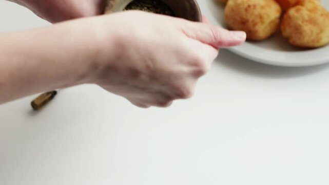 Popular breakfast in South America: Mate with Chipa, which is a type of infusion and small, baked, cheese-flavored rolls. First step, fill the cup with yerba mate