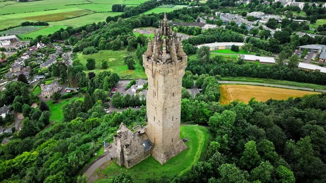Aerial view of Elaborate Victorian stone tower in Scotland, United Kingdom. The National Wallace Monument, famous landmark on a hilltop overlooking Stirling in Scotland.